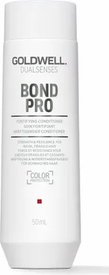 A white bottle of Goldwell Dualsenses Bond Pro Conditioner against a white background.