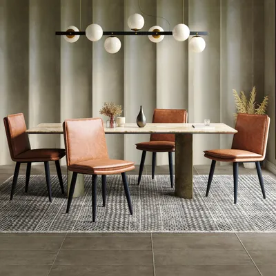 A dining room set with chairs around a table, under a modern chandelier.