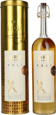A bottle of grappa and its cylindrical packaging.