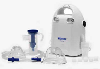 A medical nebulizer kit with its accessories laid out on a white background.