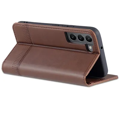 A brown leather flip case for a smartphone, shown standing up.
