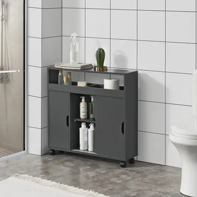 A dark gray bathroom cabinet with sliding doors and shelves, placed next to a toilet and a shower stall.