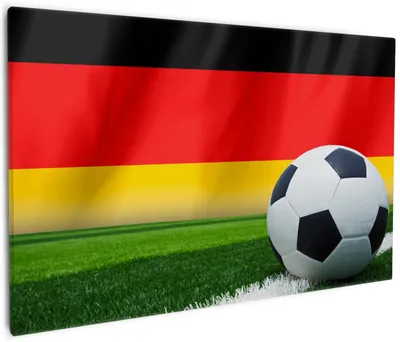 Produktbild von Wallario Premium Leinwandbild Fußball vor einer Deutschlandflagge in Größe 60 x 90 cm