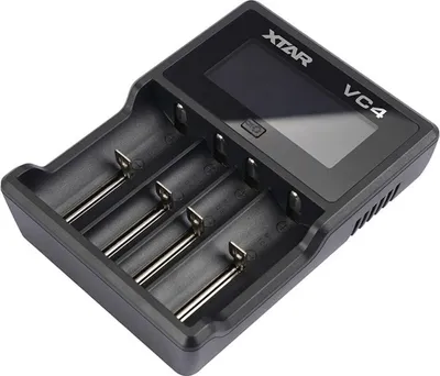 A black battery charger with four slots and a digital display.