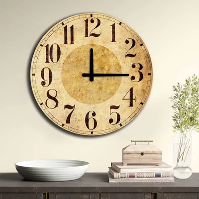A vintage-style wall clock is displayed on a wall above a shelf with decorative items.