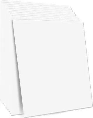A stack of white, square ceiling tiles is shown from a slightly elevated angle.
