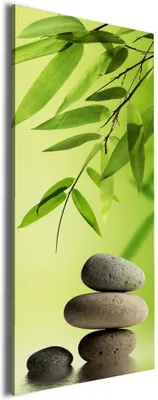 Produktbild von Wallario Premium Leinwandbild Steinstapel im Grünen in Größe 50 x 125 cm