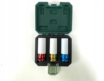 A set of three impact sockets in different colors, stored in a green plastic case.