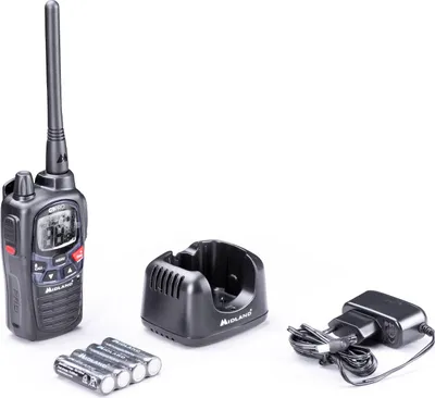 A Midland G9 Pro walkie-talkie set with accessories, laid out on a white background.