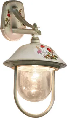 A single outdoor wall lamp with a glass enclosure and decorative floral accents.