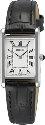 A close-up studio shot of a women's Seiko watch with a black leather strap and a white face with Roman numerals.