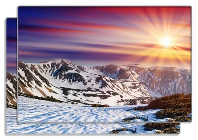 Produktbild von Wallario Frühstücksbrettchen 2er Set aus Glas, je 20 x 30 cm, mit rutschfesten Füßen, Motiv Farbenfroher Sonnenuntergang im Winter - Schnee in den Bergen