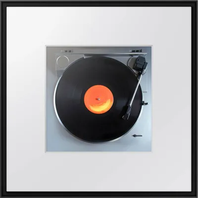 A top-down view of a record player with a vinyl record on it.