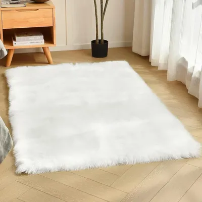 Produktbild von Teppich aus Kunstschaffell, 60 x 90 cm, weicher und flauschiger Wohnzimmerteppich aus Kunstfell, zotteliger Schlafzimmerteppich für Stühle, Wohnzimmer, Kinderzimmer (weiß)
