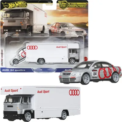 A Hot Wheels Premium Team Transport set featuring an Audi S4 Quattro and a Fleet Flyer transport truck, displayed in its original packaging.