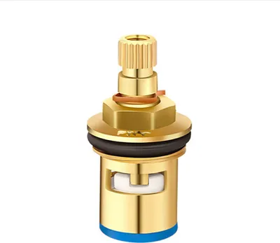 A close-up studio shot of a brass faucet valve cartridge against a white background.