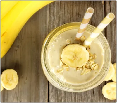 Produktbild von Spritzschutz Herdabdeckplatte Schneidebrett aus Glas Banane und Haferflocken 1-Teilig (60x52cm)