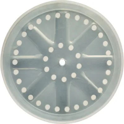 A top-down view of a round, perforated disc with a central hole and radiating spokes, likely a component of a food grinder or stuffer.