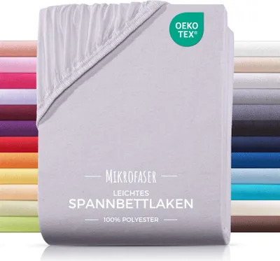 A stack of folded bed sheets, with a close-up of the top sheet showing its texture and elasticated edge. A side panel displays various colors of the same product.