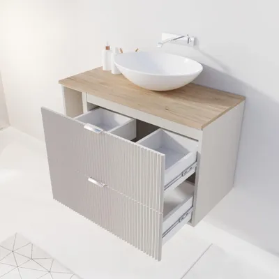 A modern bathroom vanity with a sink and faucet.