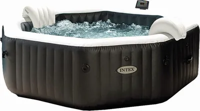 An inflatable hot tub filled with water and bubbles, with a control panel visible.