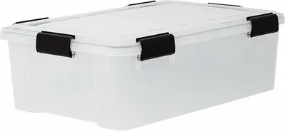 A clear studio shot of a transparent storage box with black clips.
