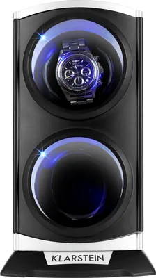 A watch winder with a watch inside, lit by blue LEDs.