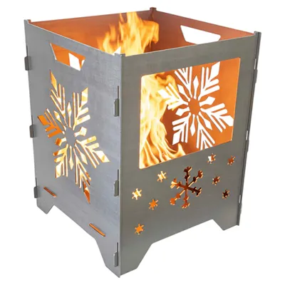 A metal fire pit with snowflake cutouts, showing flames inside.