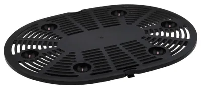 A black plastic grate with multiple circular indentations and slotted openings, viewed from a slightly elevated angle.
