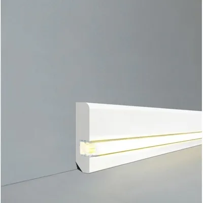 A white baseboard with integrated LED lighting is shown against a gray wall and floor.