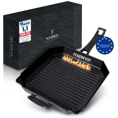A black cast iron grill pan with flames depicted on it, placed next to its packaging box.