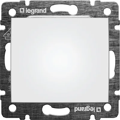 A close-up of a white light switch frame with a metallic border.