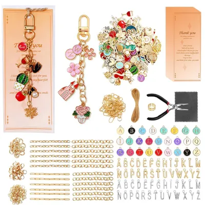 Immagine prodotto di Kit per creare portachiavi, composto da 702 pezzi, con ciondoli, anelli, ganci a scatto, bigliettini e sacchetti