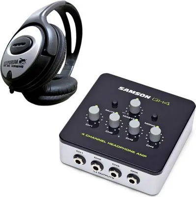 A pair of headphones and a headphone amplifier are shown against a white background.