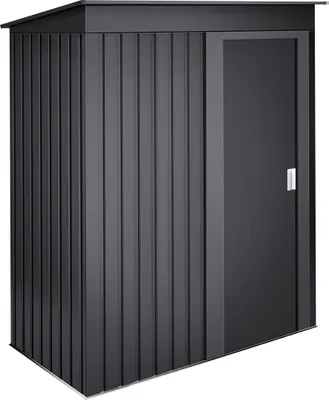A dark gray metal storage shed with a sliding door.
