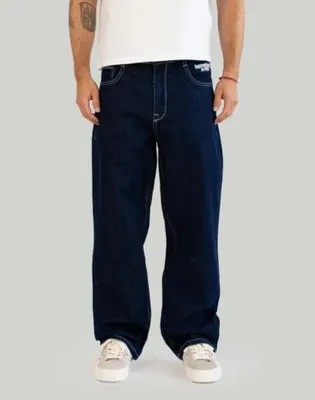 Image de Pantalon baggy "Homeboy" en denim indigo unicolore, coupe ample, taille 29/30