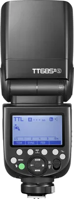 A close-up studio shot of a black camera flash unit.