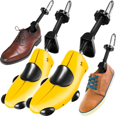 A collection of shoe stretchers and shoes against a white background.