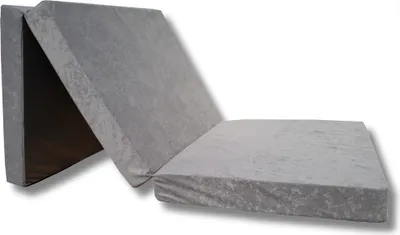 A folded gray mattress is shown against a white background.
