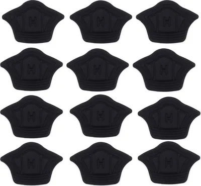 A grid of black shoe inserts.