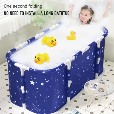A young girl is taking a bath in a portable bathtub filled with bubbles and rubber ducks.