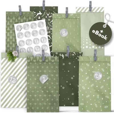 A collection of green paper advent bags with various Christmas-themed patterns, clipped together and some with numbered stickers.