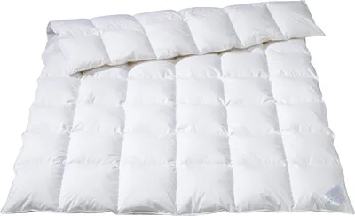 A white duvet or comforter is folded and laid out on a white background.