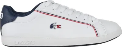 A side view of a white Lacoste sneaker with navy blue accents.