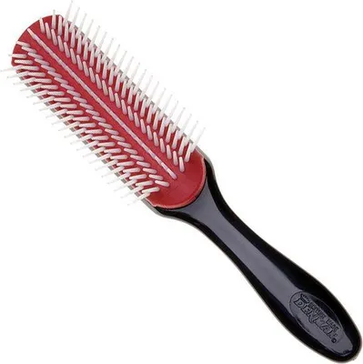 A studio shot of a hairbrush against a white background.