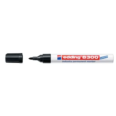 A black marker pen with its cap off, lying next to the cap, on a white background.