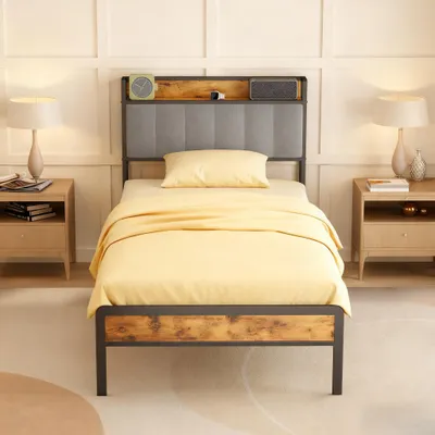 A bedroom scene with a bed, nightstands, and lamps.