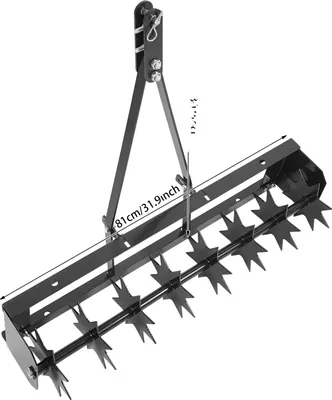 A black lawn aerator tool is shown against a white background. Dimensions are indicated with text overlays.