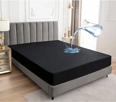 A mattress protector on a bed with water being poured on it.