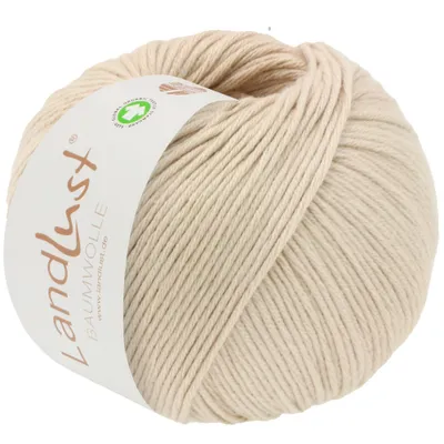 A ball of beige yarn with a label.